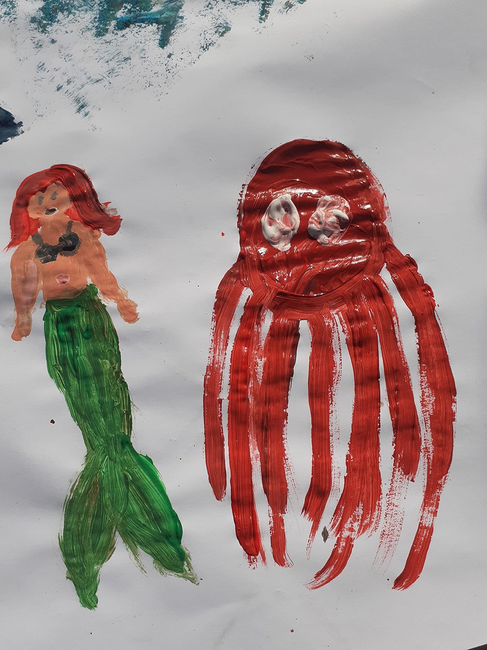 disegno fatto da bambino rappresentante una sirenetta e un polpo disegno fatto da bambino rappresentante una sirenetta e un polpo